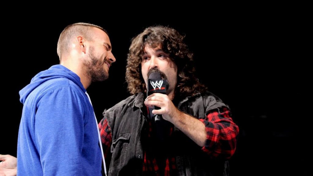 Mick Foley responde a Roman Reigns: "CM Punk fue muy bueno, maldita sea"